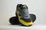 Nike Air Max 1 Essential Batman 2.0 - Geel/Grijs/Zwart - Heren/Dames/Uniseks Sneakers - Leer/Suede/Mesh - FZ5808-014 - Voorkant