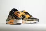 Nike Air Max 90 Premium Black University Gold Camo - Geel/Zwart - Heren/Dames/Uniseks Sneakers - Leer/Mesh - IF1721-001 - Achterkant